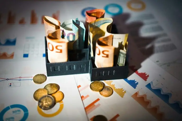 A pile of money sitting on top of a table